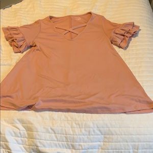 light pink shirt with ruffled sleeves